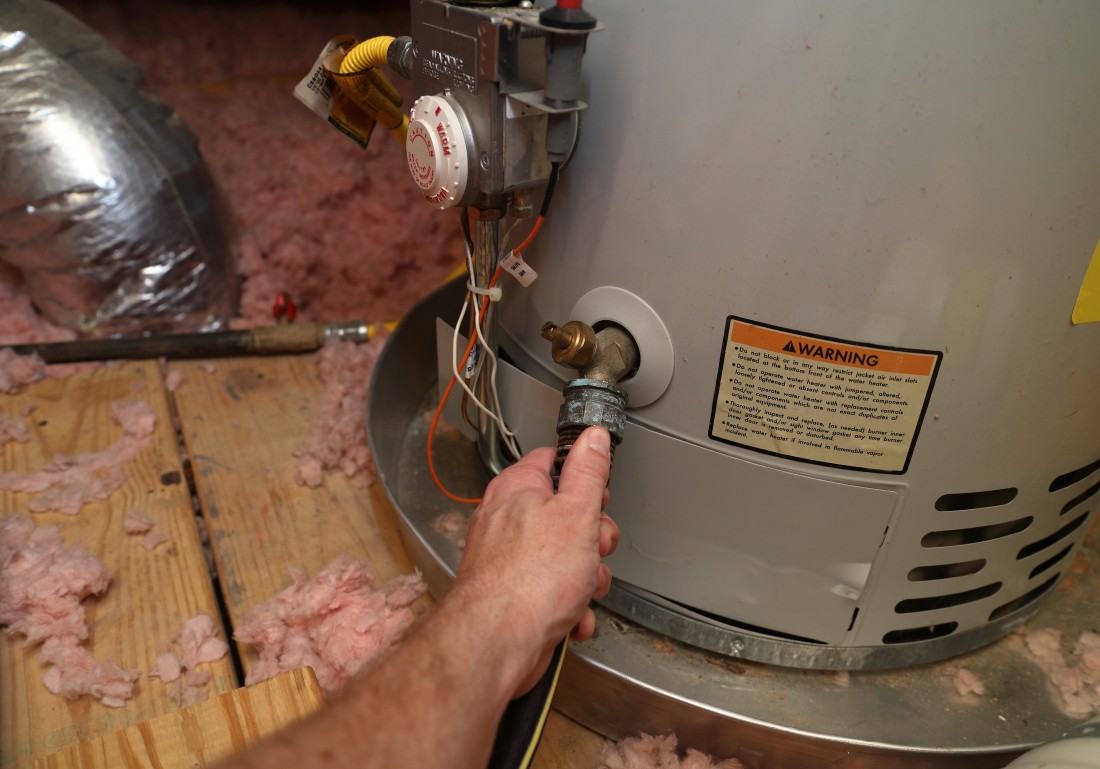 Employee working on furnace