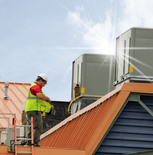 Employee working on roof.